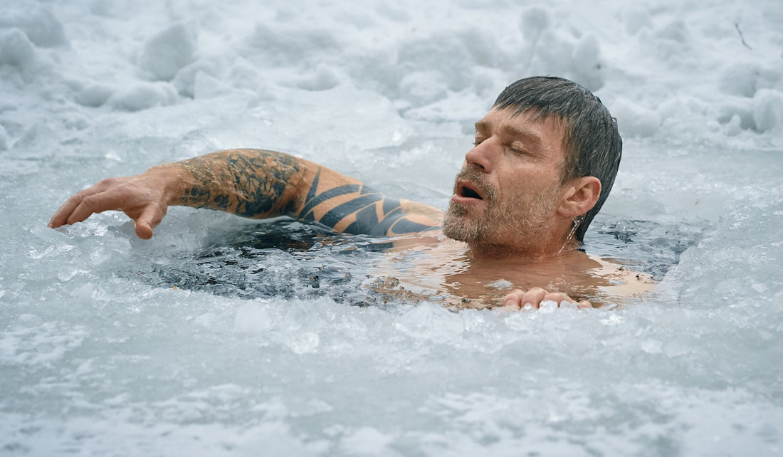 A person cold water plunging in icy water outdoors