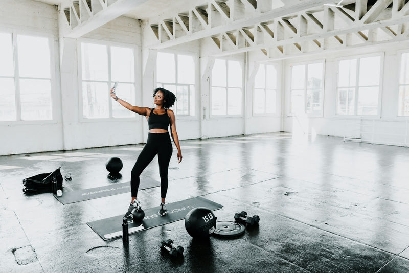 Kettlebell strength training in a bright studio
